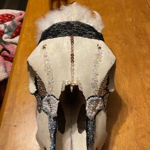Hand painted, rhinestones also hand placed. Cow decor